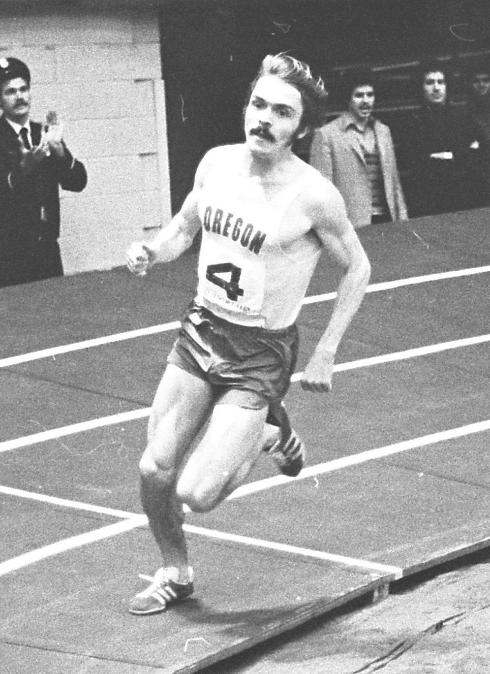 Steve Prefontaine in the Oregon number 4 singlet pulling away in the final turn of the mile at the 1973 LA Times Indoor Games